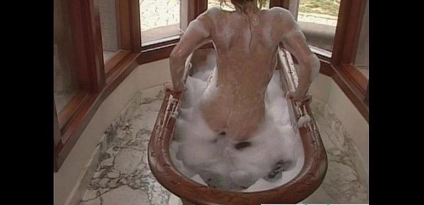  Blonde masturbates with shower in bath tub
